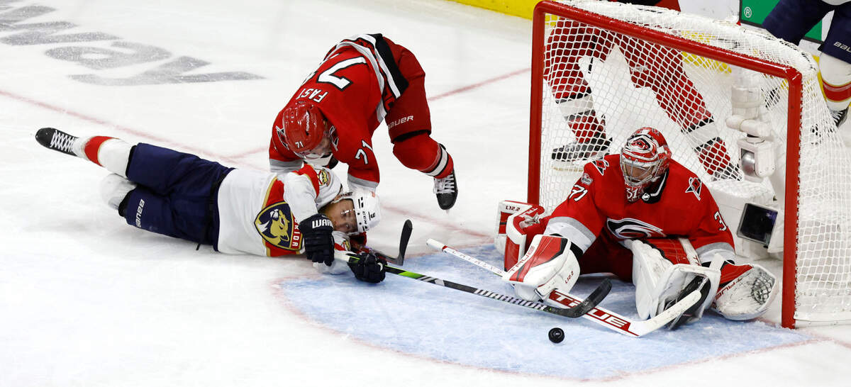 Florida center Sam Bennett (9) is defended by Carolina right wing Jesper Fast (71) and goaltender Frederik Andersen (31) during the second overtime of the Hurricanes’ game against the Panthers in the first game of Eastern Conference Finals at PNC Arena in Raleigh, N.C., early Friday morning, May 19, 2023.