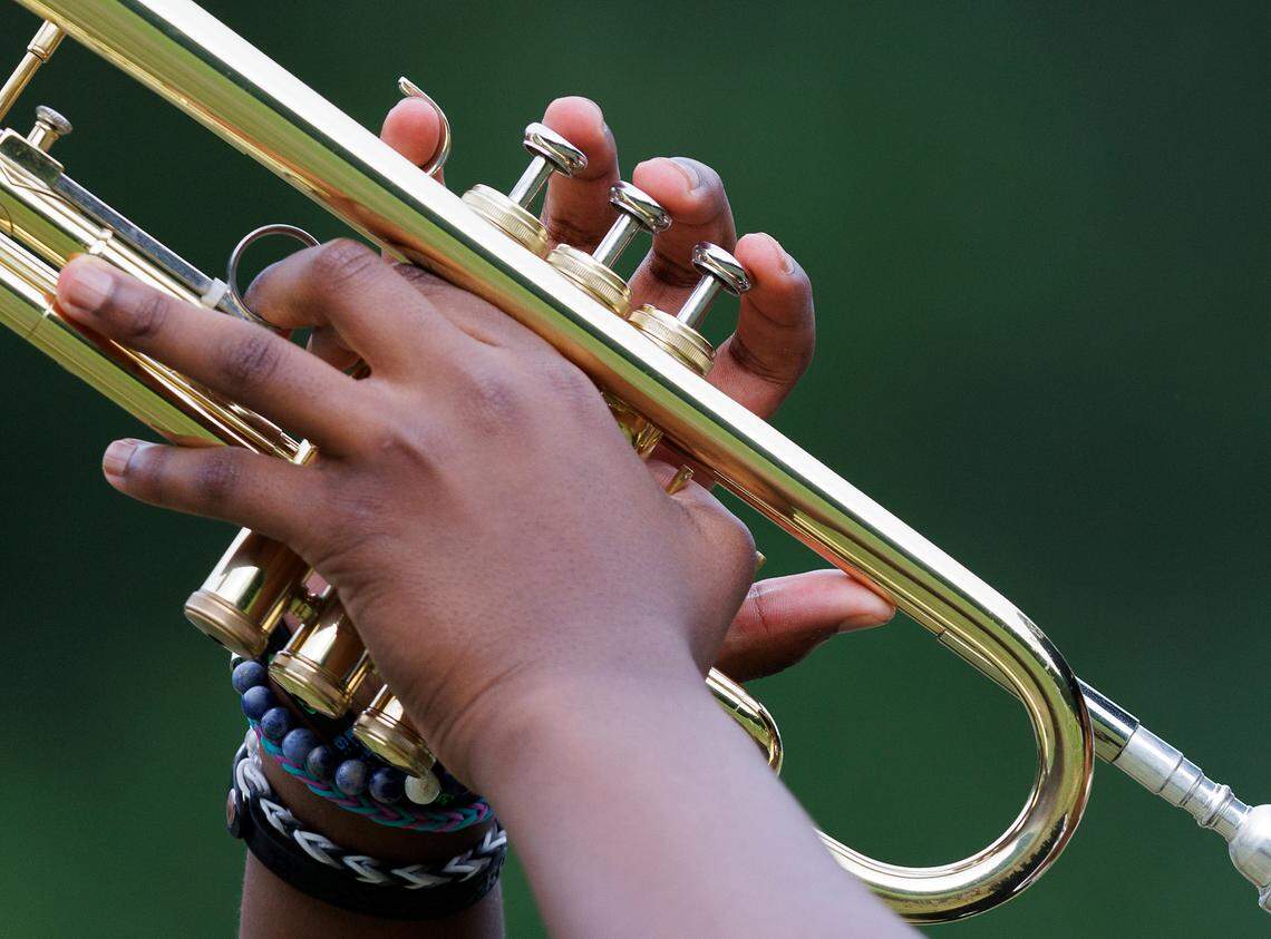Freshman Julian Watson plays the trumpet during the final day of marching band camp at Jordan High School on Friday, August 2, 2024, in Durham, N.C.