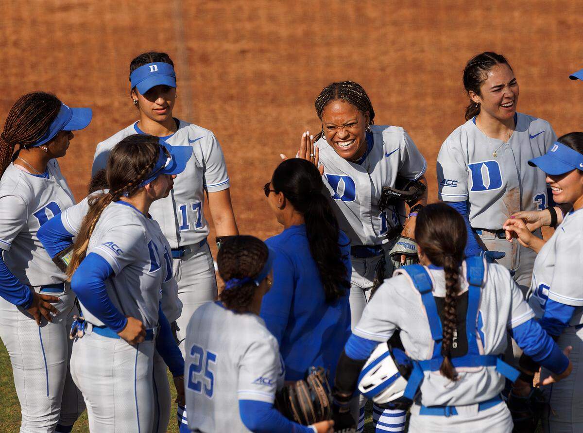 Duke’s Jala Wright, center, high fives head coach Marissa Young during the Blue Devils’ 6-0 win over Longwood on Wednesday, April 24, 2024, in Durham, N.C.