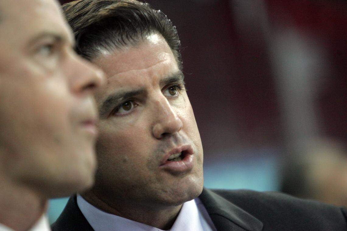 Then-Carolina Hurricanes head coach Peter Laviolette, right, confers with assistant coach Jeff Daniels during an exhibition game against the Atlanta Thrashers at the RBC Center on Sept. 21, 2005.