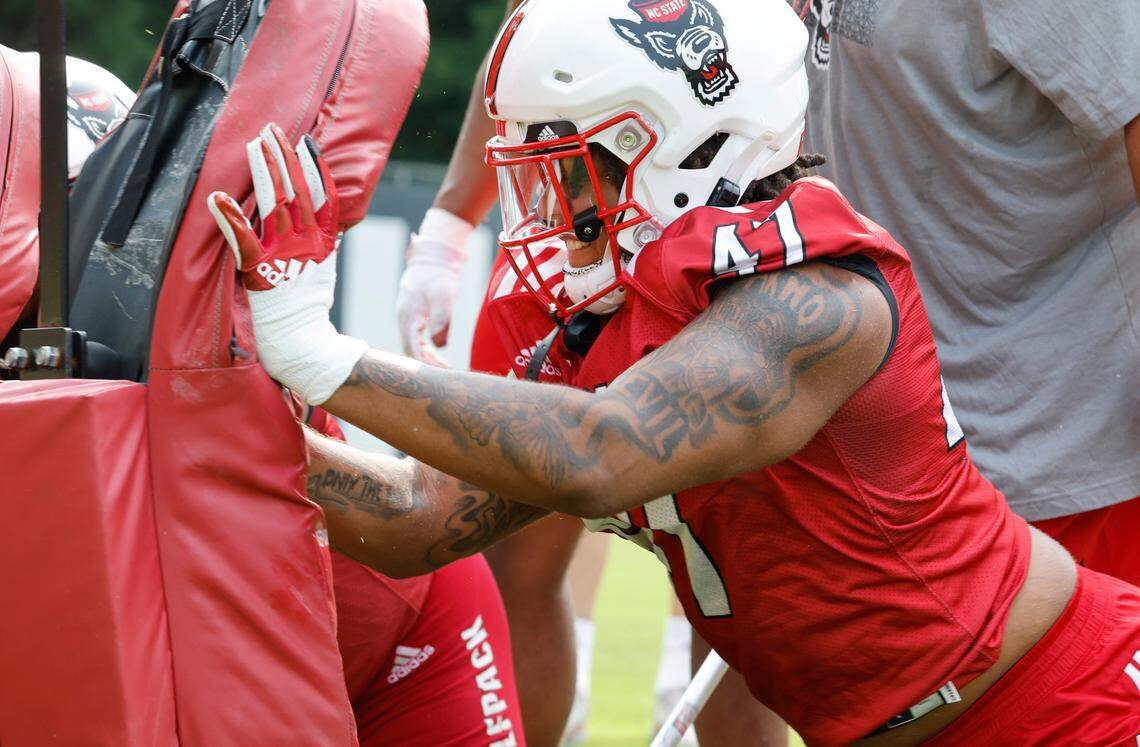 N.C. State defensive lineman Red Hibbler (47) hits the pad during the Wolfpack’s first fall practice in Raleigh, N.C., Wednesday, August 2, 2023.