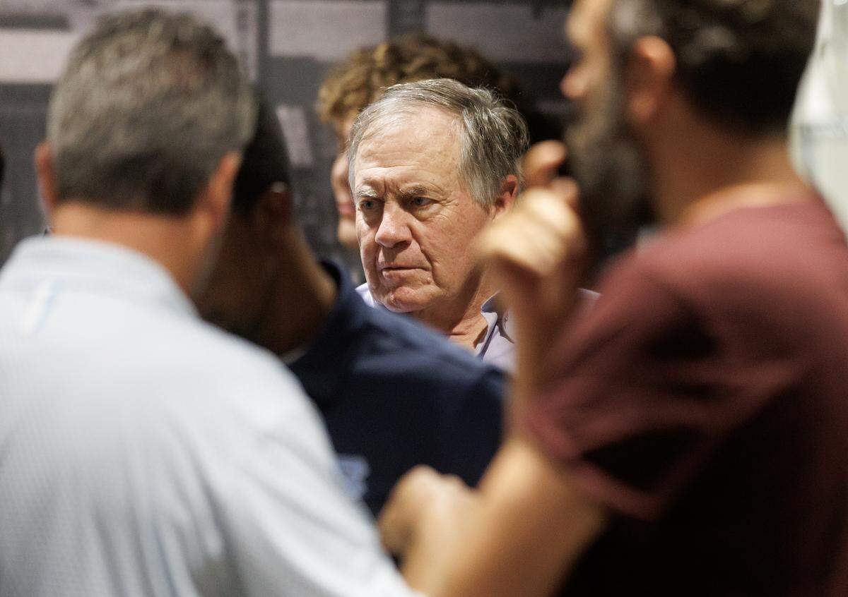 North Carolina head football coach Bill Belichick stands among supporters following an appearance on the “Carolina Football Live” weekly radio show on Wednesday, Aug. 27, 2025, at Top of the Hill Restaurant & Brewery in Chapel Hill, N.C. 