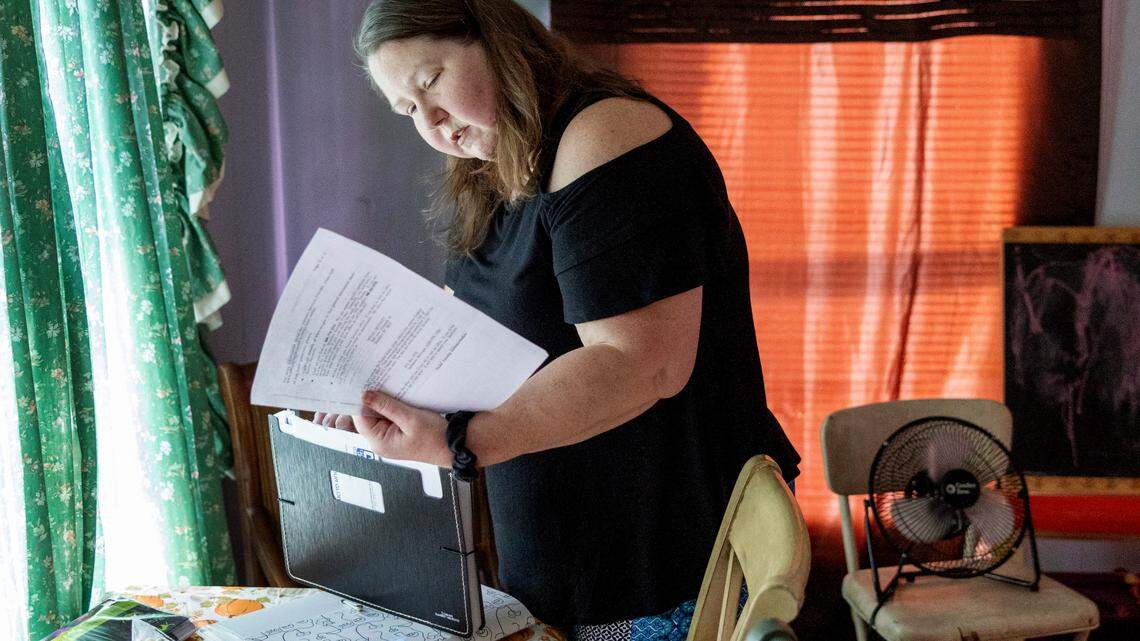 DeAnna Brandon, 45, of Salisbury looks through some of her medical bills and documents. Brandon was recently diagnosed with multiple myeloma, a rare blood cancer. Brandon does not have insurance, and charity care, through which hospitals provide free or discounted services to eligible low-income patients, won’t cover the cost of up to $200,000 to harvest and transplant her own stem cells.