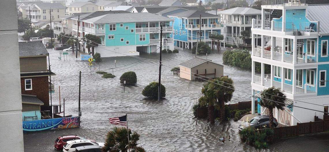 Flood waters cover all the roads visible from the Atlantic Towers in Carolina Beach on Monday after more than a foot of rain from a coastal storm.