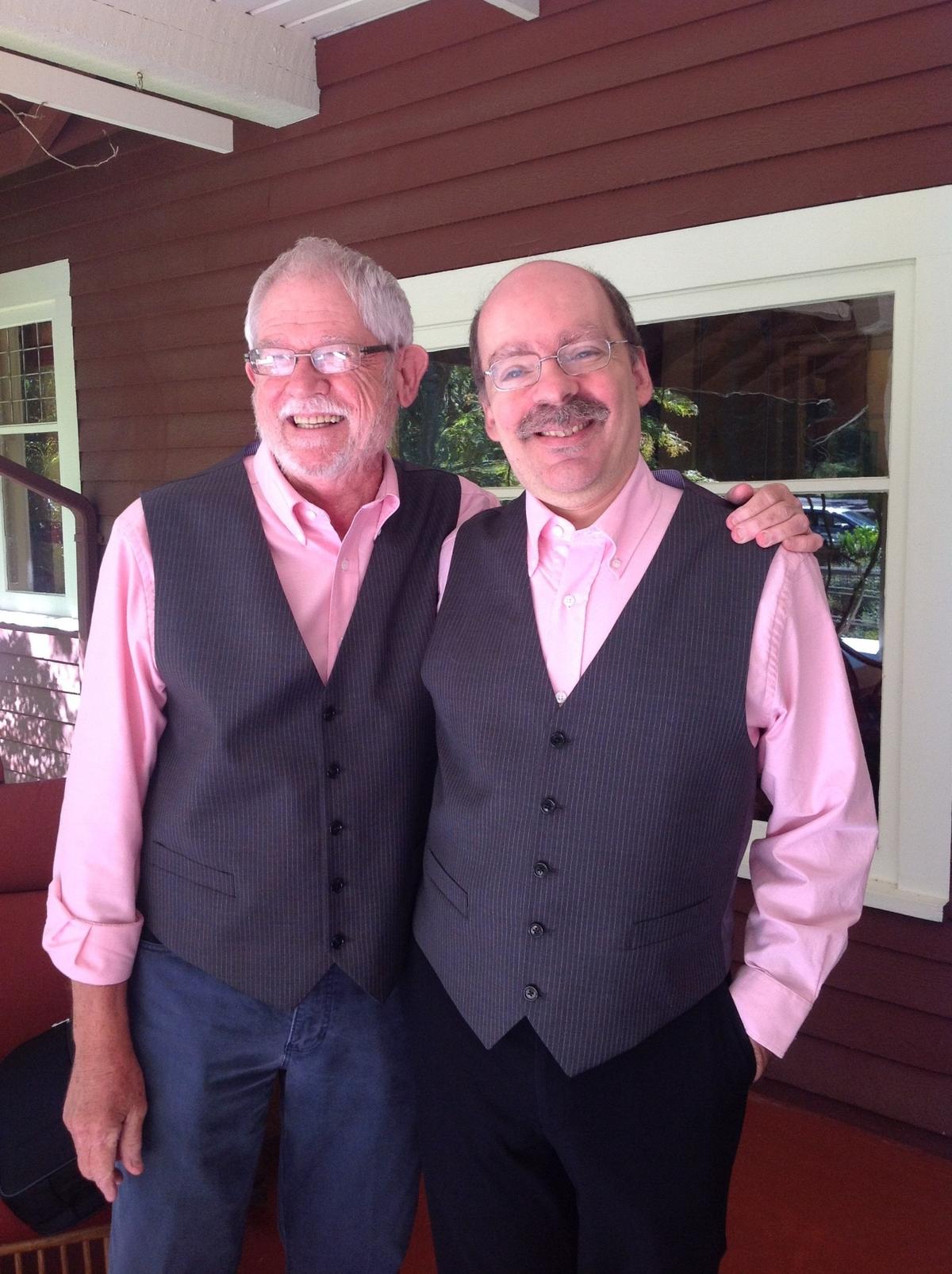 Tom Attaway, left, with Chuck Small at the Raleigh couple’s 2014 wedding in the San Juan Islands. Small is a lifelong Catholic who has stayed in the church despite its official position on same-sex marriage.