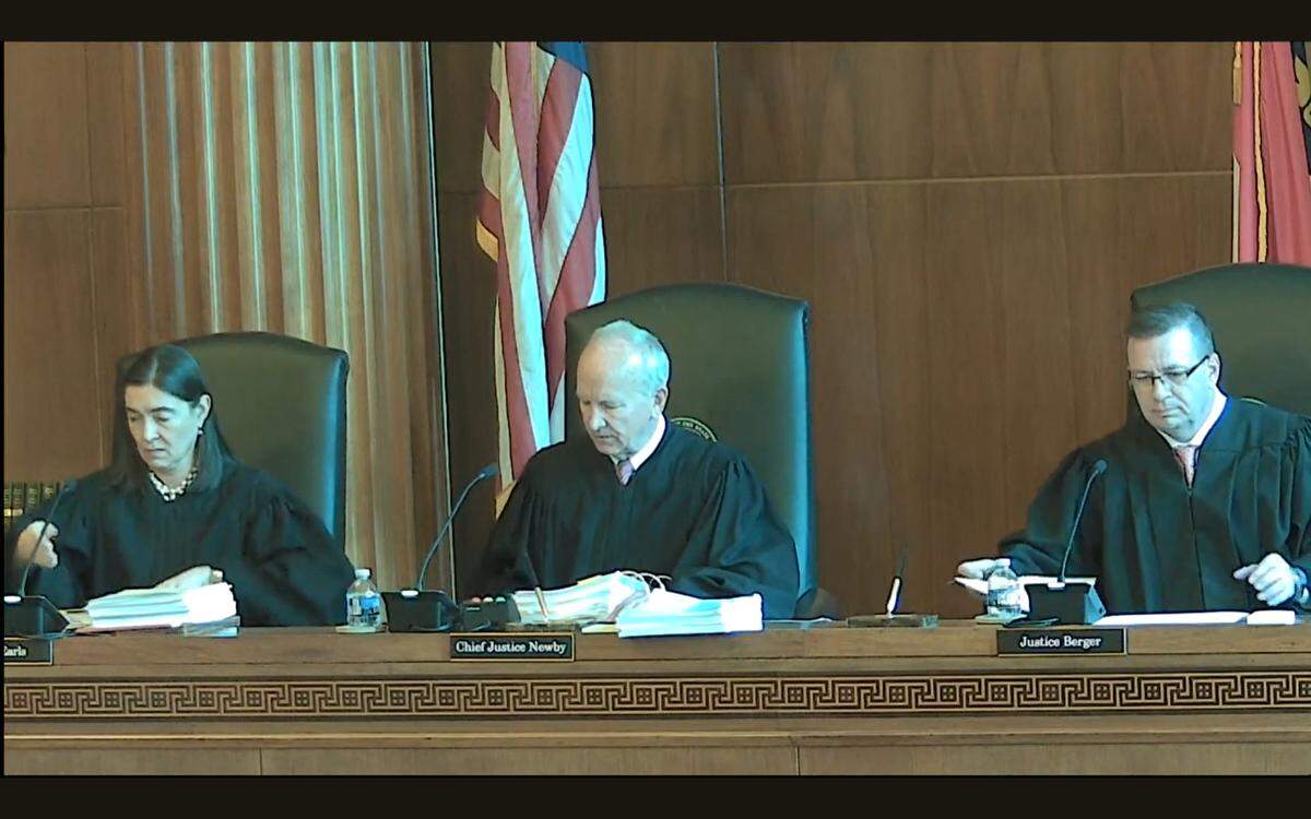 Associate Justice Anita Earls, Chief Justice Paul Newby and Associate Justice Phil Berger Jr. hear arguments in the Leandro case at the N.C. Supreme Court in Raleigh, N.C., on Feb. 22, 2024.