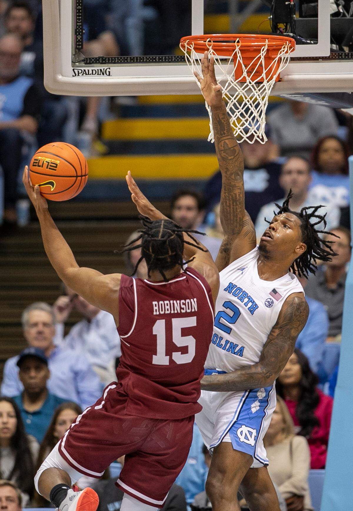 North Carolina’s Caleb Love (2) defends College of Charleston’s Pat Robinson III (15) during the second half on Friday, November 11, 2022 at the Smith Center in Chapel Hill, N.C.