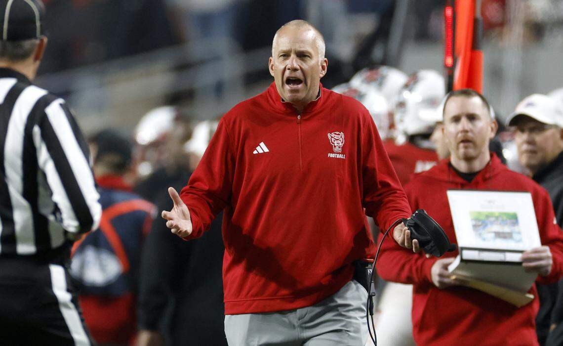 N.C. State head coach Dave Doeren has words with an official during the first half of N.C. State’s game against Georgia Tech at Carter-Finley Stadium in Raleigh, N.C., Saturday, Nov. 1, 2025.