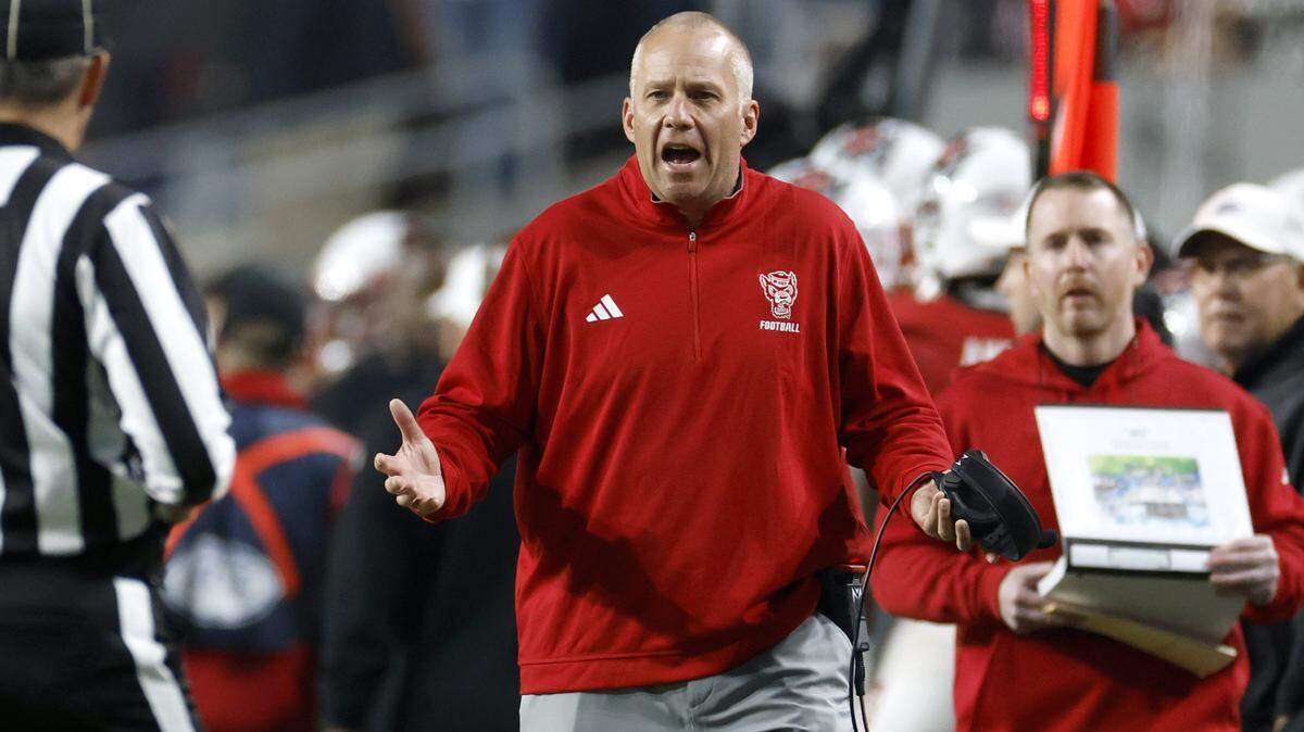 N.C. State head coach Dave Doeren has words with an official during the first half of N.C. State’s game against Georgia Tech at Carter-Finley Stadium in Raleigh, N.C., Saturday, Nov. 1, 2025.