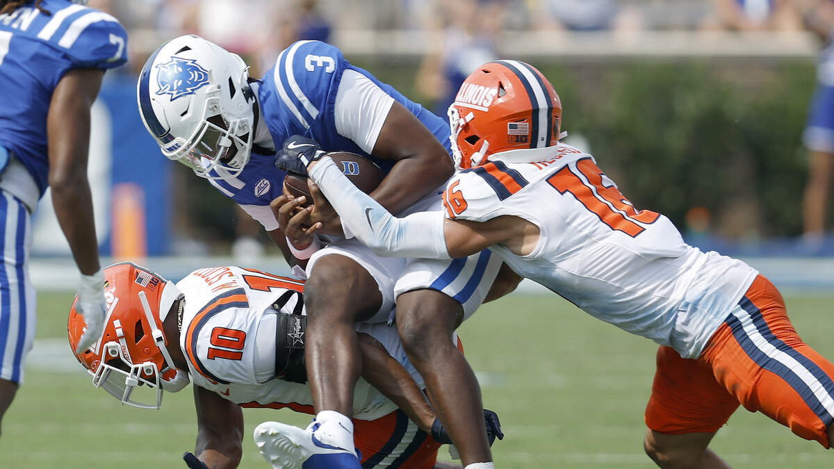 Duke quarterback Henry Belin IV is brought down by Illinois’ Miles Scott and Tanner Heckel during the second half of the Blue Devils’ 45-19 loss on Saturday, Sept. 6, 2025, at Wallace Wade Stadium in Durham, N.C.