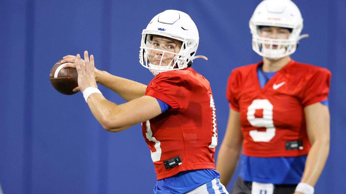Duke quarterback Riley Leonard (13) prepares to pass during the Blue Devils’ first practice of fall camp in Durham. N.C. Tuesday, August 2, 2022.
