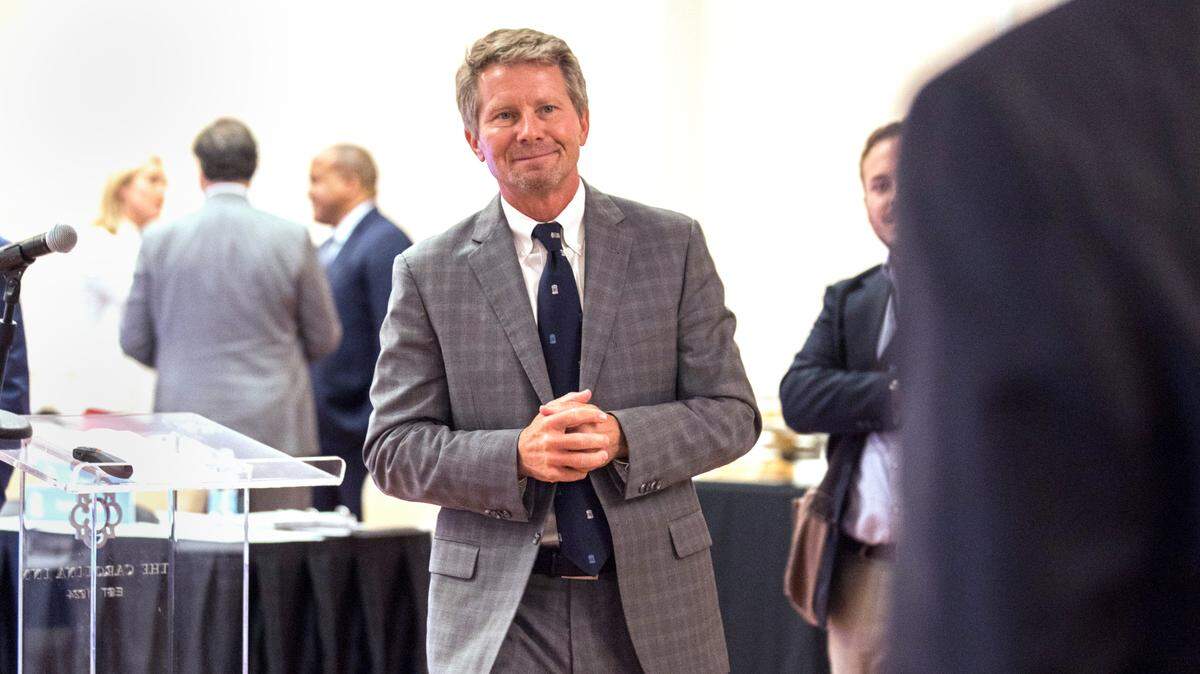 UNC-Chapel Hill Chancellor Kevin Guskiewicz greets someone after the start of a UNC Board of Trustees meeting at The Carolina Inn in Chapel Hill, N.C. on Wednesday, July 14, 2021.