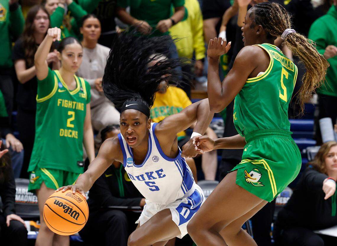 Duke’s Oluchi Okananwa drives past Oregon’s Amina Muhammad during the first half of the Blue Devils’ second round NCAA Tournament game on Sunday, March 23, 2025, at Cameron Indoor Stadium in Durham, N.C.