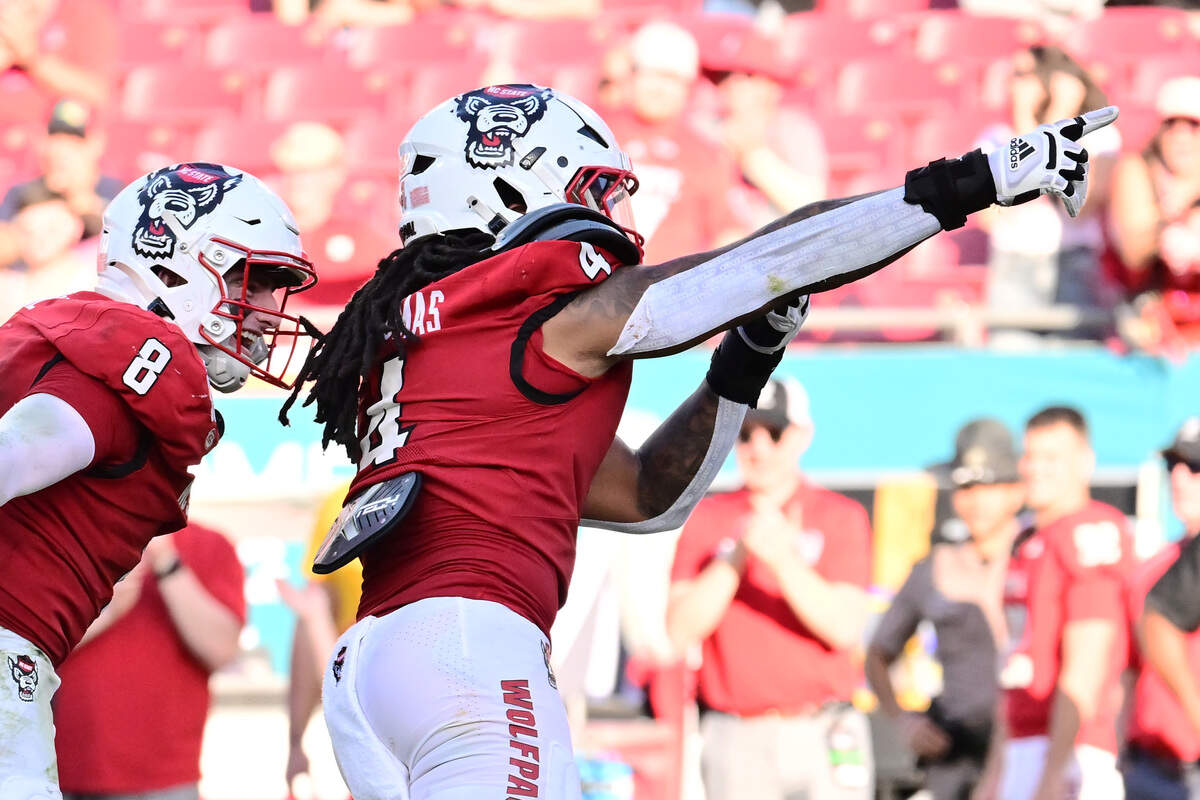 N.C. State’s Tra Thomas (4) reacts after a sack in the first half against the Memphis Tigers during the 2025 Union Home Mortgage Gasparilla Bowl at Raymond James Stadium on Dec. 19, 2025 in Tampa, Florida.