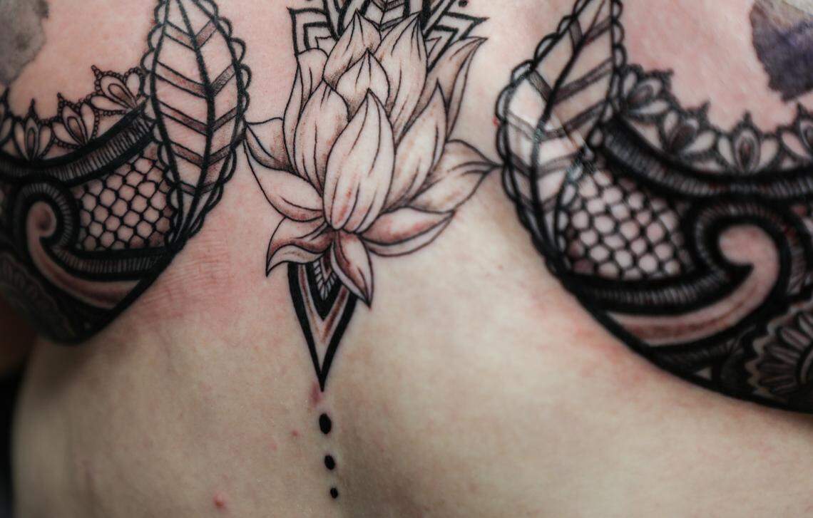 More than four hours after Petrina Hamm walked into the Apex Tattoo Factory on Monday March 26, 2018, she had a completed decorative tattoo covering her mastectomy and reconstructive surgery scars. The tattoo, a collaboration between Hamm and Myers, has a floral and lace feminine theme. With Art from Scars, Hamm hopes to provide the opportunity for more women to get tattoos that make them feel more confident in their bodies after surviving cancer.