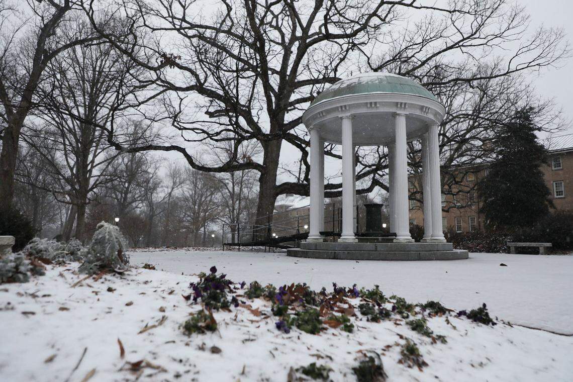 Snow accumulates around the Old Well at UNC-Chapel Hill in Chapel Hill, N.C. on Sunday, Jan. 16, 2022.
