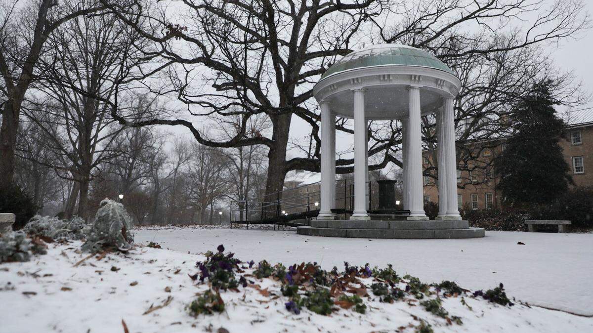 Snow accumulates around the Old Well at UNC-Chapel Hill in Chapel Hill, N.C. on Sunday, Jan. 16, 2022.