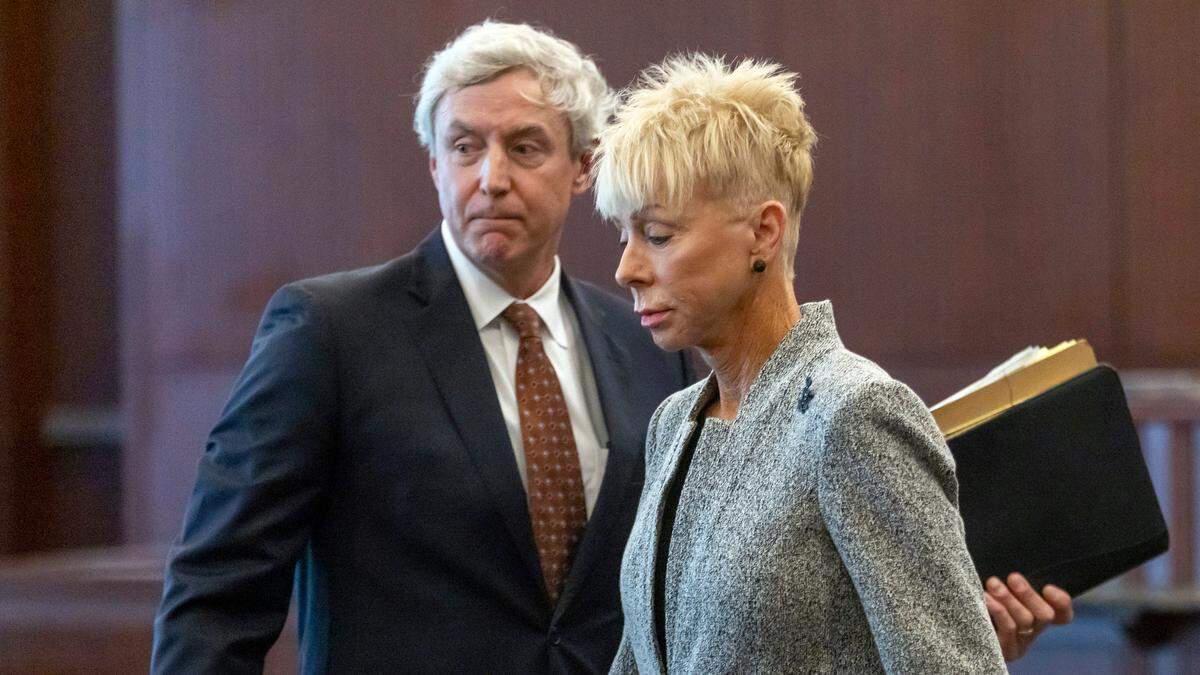 North Carolina State Auditor Beth Wood leaves the Wake County courtroom with her attorney Roger Smith after pleading guilty to misdemeanor hit-and-run on Thursday, March 23, 2023 in Raleigh, N.C.