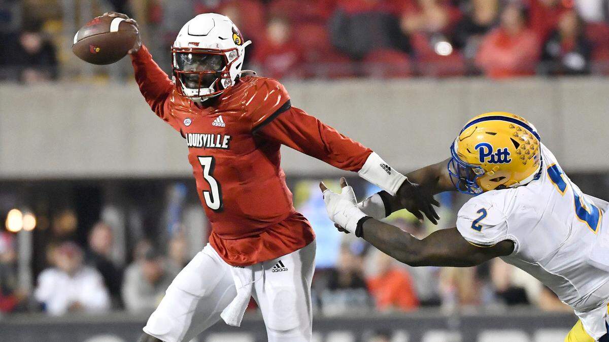 Louisville quarterback Malik Cunningham (3) looks to pass while under pressure from Pittsburgh defensive lineman David Green (2) during the second half of an NCAA college football game in Louisville, Ky., Saturday, Oct. 22, 2022.