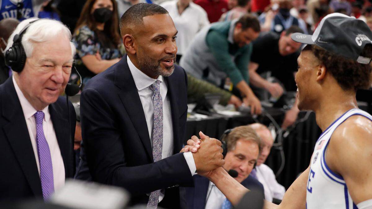 Grant Hill greets Wendell Moore Jr. after Duke’s 78-69 victory over Arkansas in the NCAA Tournament West Regional finals at the Chase Center in San Francisco, Calif., Saturday, March 26, 2022.
