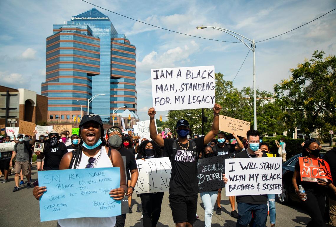 A protest organized by two 13-year-old friends, Beautiful Green, a ninth-grader, and Morgan Johnson, an eighth-grader, climbs up Morgan Street after gathering in CCB Plaza, in response to the death of George Floyd and others, on Saturday, Jun. 6, 2020, in Durham, N.C.