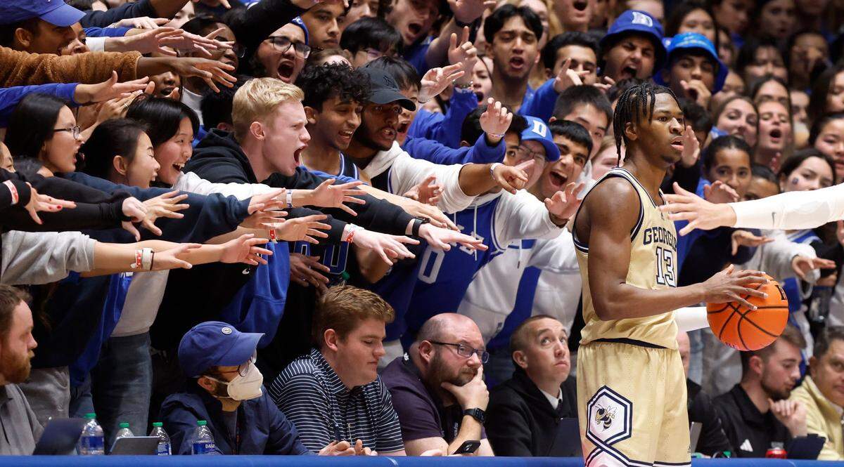 The Cameron Crazies hex Georgia Tech’s Miles Kelly as he waits to inbound the ball during the second half of Duke’s 84-79 victory over Georgia Tech at Cameron Indoor Stadium in Durham on Jan. 13, 2024.
