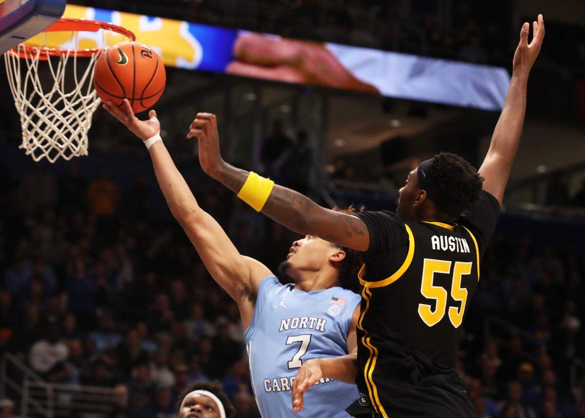 North Carolina Tar Heels guard Seth Trimble (7) goes to the basket against Pittsburgh Panthers forward Zack Austin (55) during the first half at the Petersen Events Center.