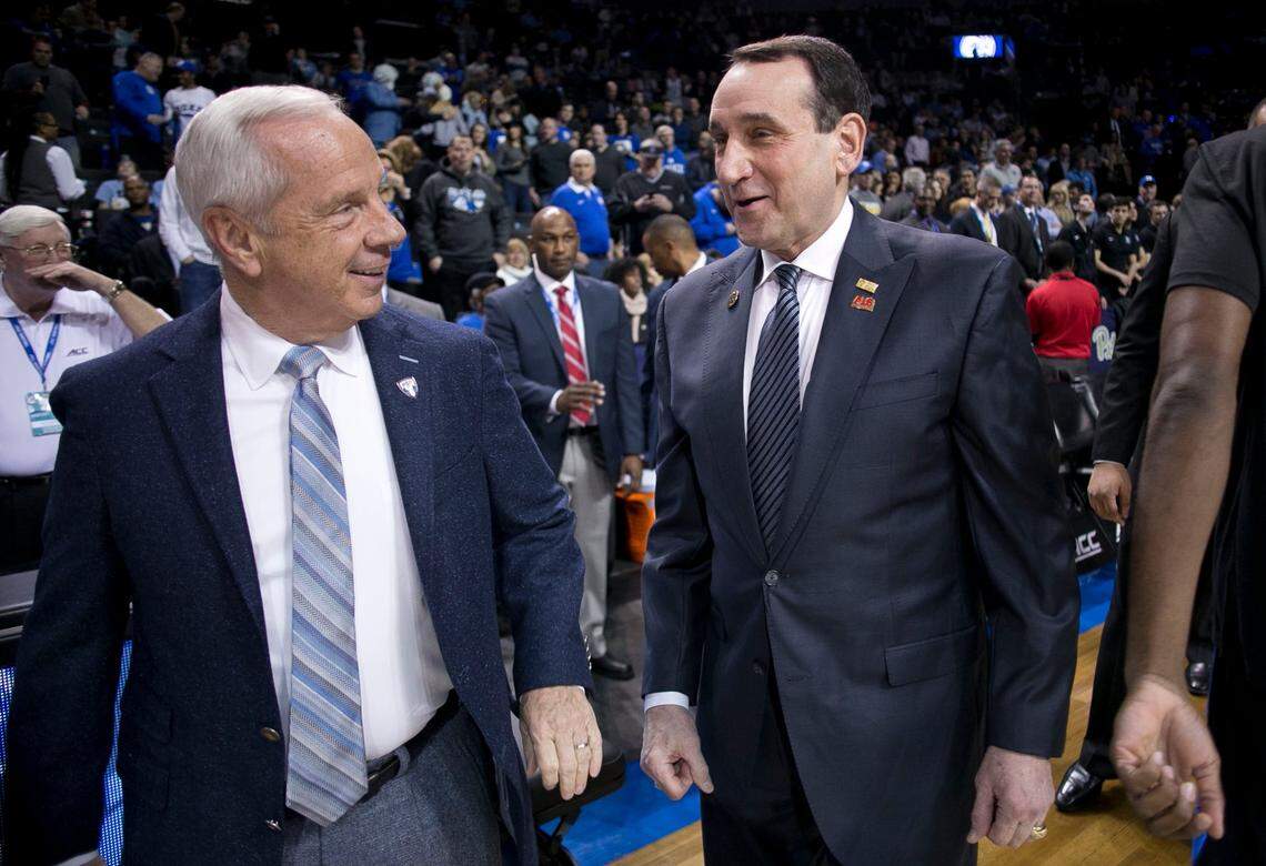 Duke coach Mike Krzyzewski talks with North Carolina coach Roy Williams prior to their game in the semi-finals of the ACC Tournament on Friday, March 10, 2017 at the Barclays Center in Brooklyn, N.Y.