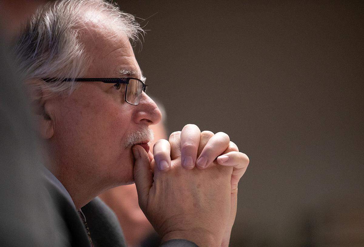 Sam Watts, executive administrator of the State Health Plan, listens as the plan’s board of trustees debate options for coverage of weight loss drugs during a meeting on Thursday, Jan. 25, 2024, in Raleigh, N.C.
