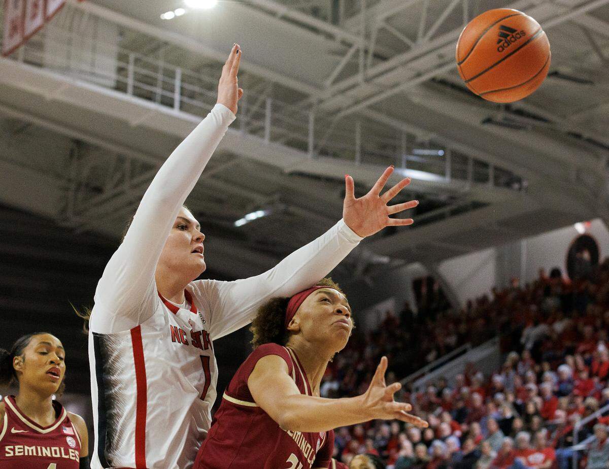 Florida State’s Makayla Timpson gets a rebound in front of N.C. State’s River Baldwin during the first half of the Wolfpack’s game on Thursday, Jan. 4, 2023, at Reynolds Coliseum in Raleigh, N.C.