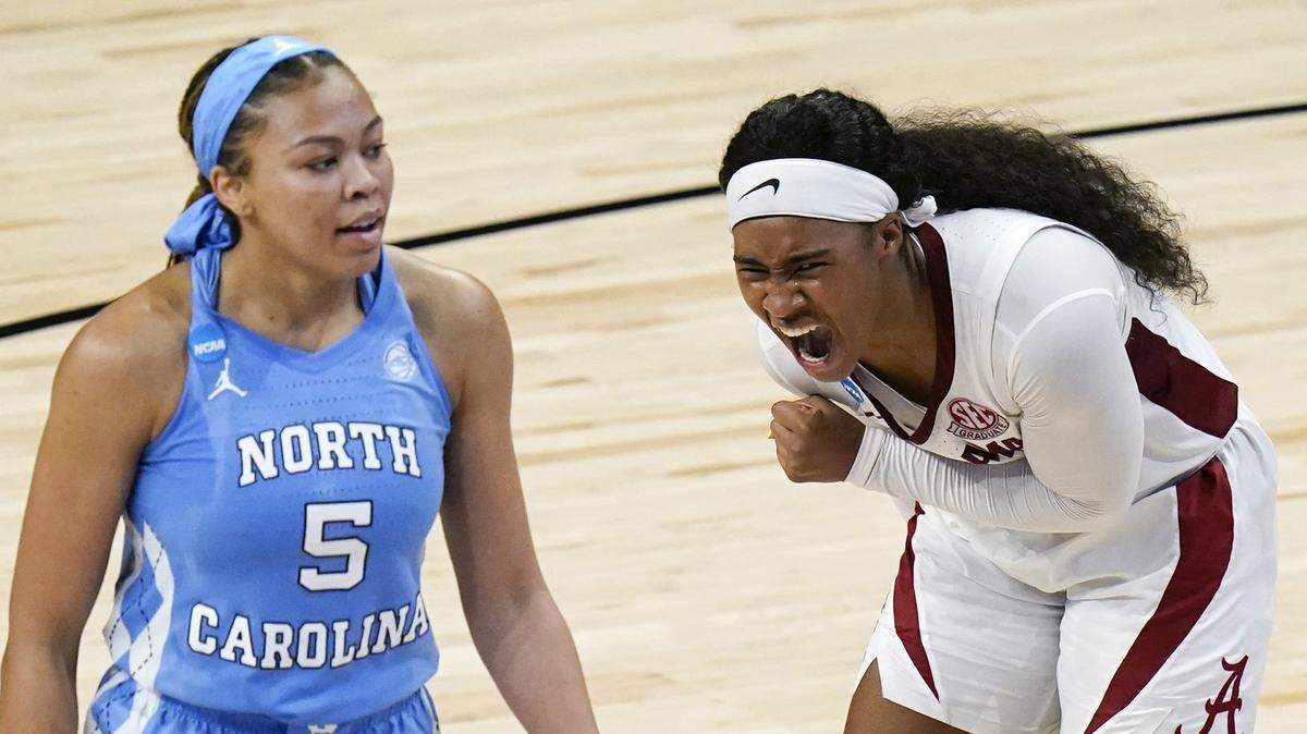 Alabama guard Jordan Lewis, right, celebrates in front of North Carolina guard Stephanie Watts (5) at the end of a college basketball game in the first round of the women’s NCAA tournament at the Alamodome in San Antonio, Monday, March 22, 2021. Alabama won 80-71. 