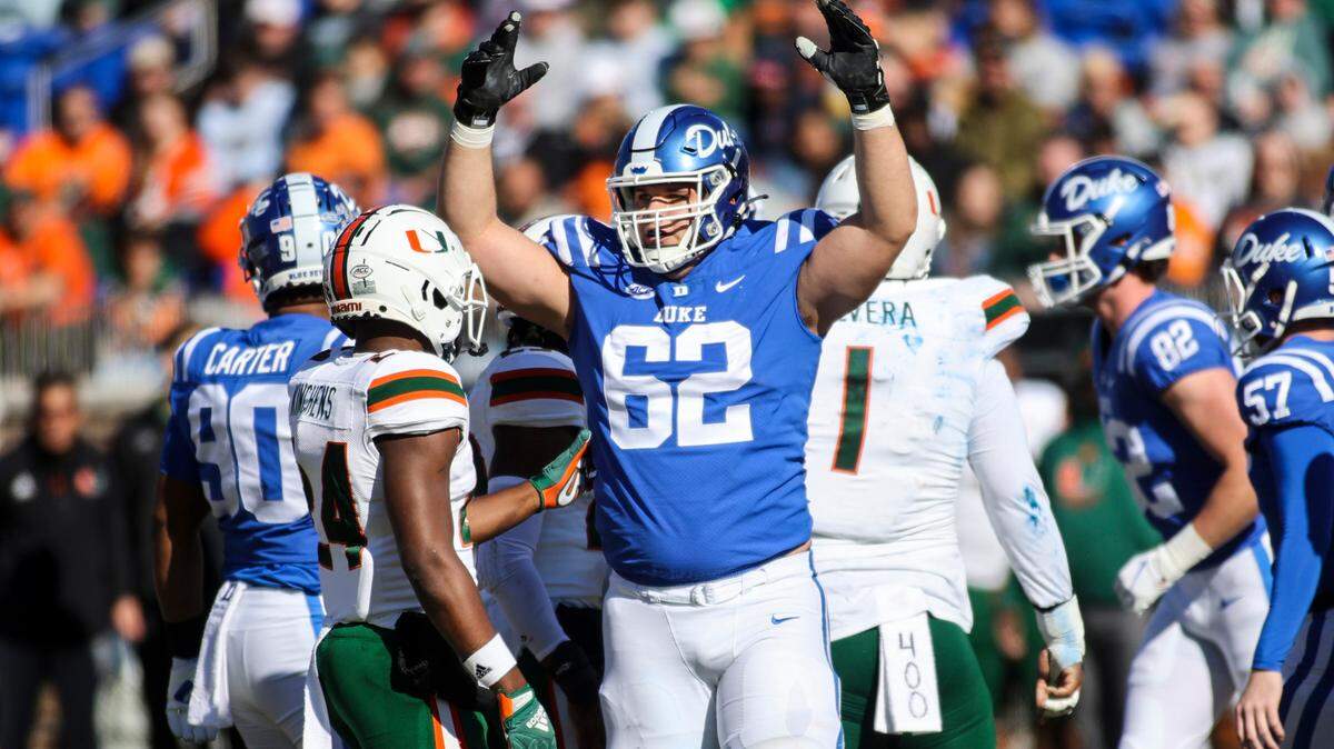 Duke tackle Graham Barton (62) celebrates during a Blue Devils football game with Miami in November 2021 at Wallace Wade Stadium. Barton is considered one of the top tackles available for the 2024 NFL Draft.
