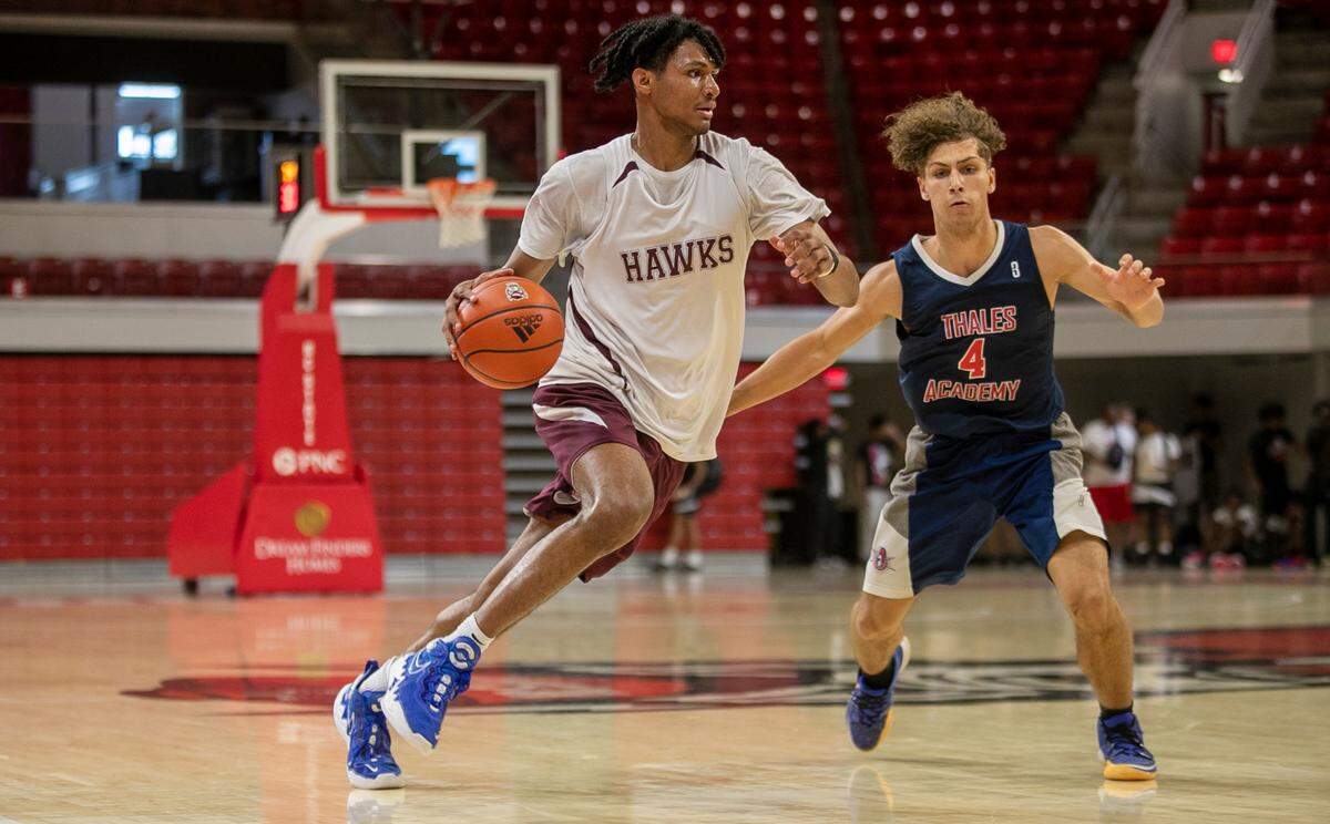 Jarin Stevenson pushes the ball up court during a game against Thales Academy, at N.C. State’s Reynolds Coliseum, during a summer basketball camp on Tuesday, June 13, 2023 in Raleigh, N.C.
