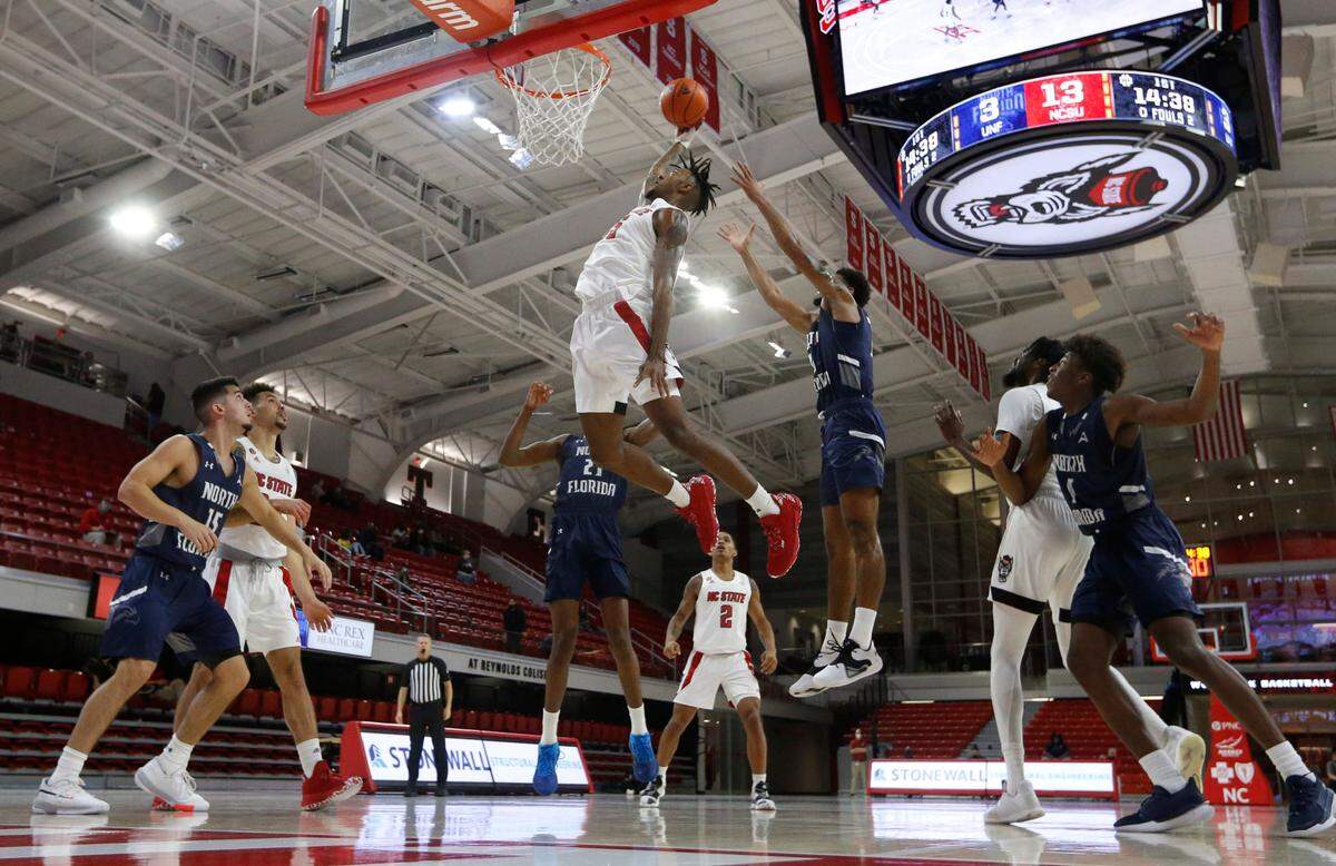 N.C. State’s Manny Bates (15) tries to slam in the loose ball during N.C. State’s 86-51 victory over North Florida in the Mako Medical Wolfpack Invitational at Reynolds Coliseum in Raleigh, N.C., Friday, Nov. 27, 2020.