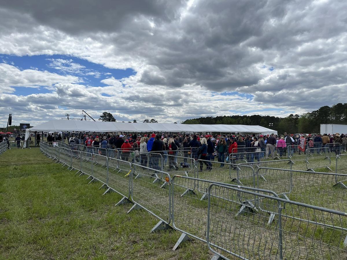 People wait to enter the Trump rally in Selma, NC, on April 9, 2022.