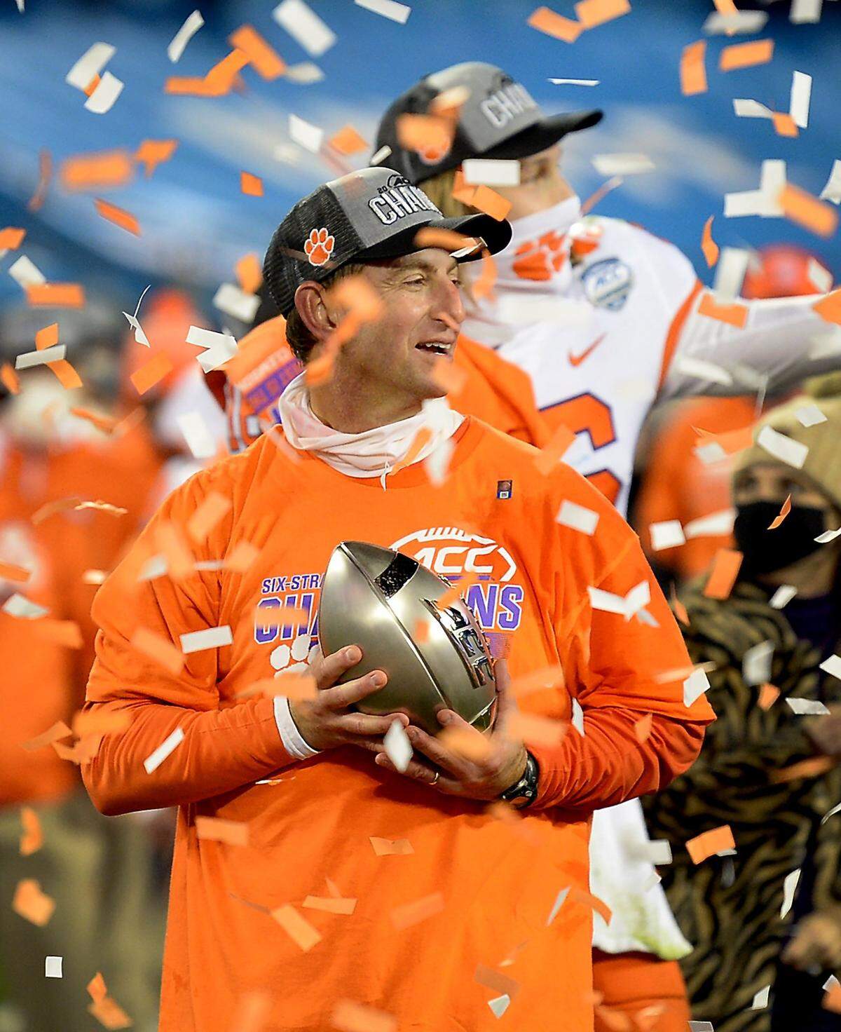 Clemson Tigers head coach Dabo Swinney smiles at his team as he holds the ACC Championship trophy following his teamÕs victory over Notre Dame 34-10 at Bank of America Stadium in Charlotte, NC on Saturday, December 19, 2020.