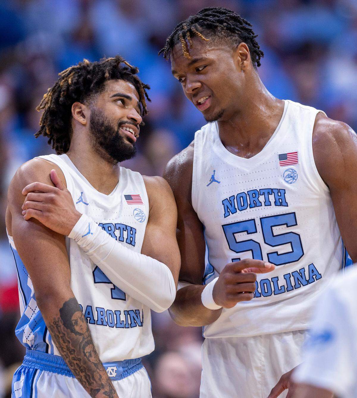 North Carolina’s R.J. Davis (4) chats with teammate Harrison Ingram (55) during a time out in the second half against Charleston Southern on Friday, December 29, 2023 at the Smith Center in Chapel Hill, N.C.