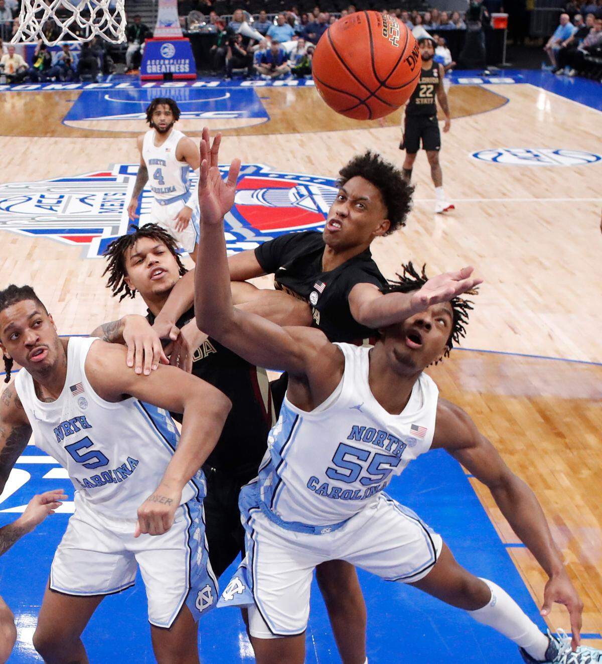 North Carolina’s Harrison Ingram (55) pulls in the rebound from Florida State’s Baba Miller (11) during UNC’s 92-67 victory over Florida State in the quarterfinal round of the 2024 ACC Men’s Basketball Tournament at Capital One Arena in Washington, D.C., Thursday, March 14, 2024.