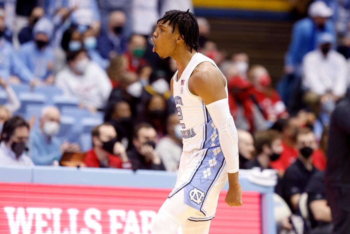North Carolina’s Caleb Love (2) celebrates hitting a three-pointer during the first half of UNC’s game against N.C. State at the Smith Center in Chapel Hill, N.C., Saturday, Jan. 29, 2022.