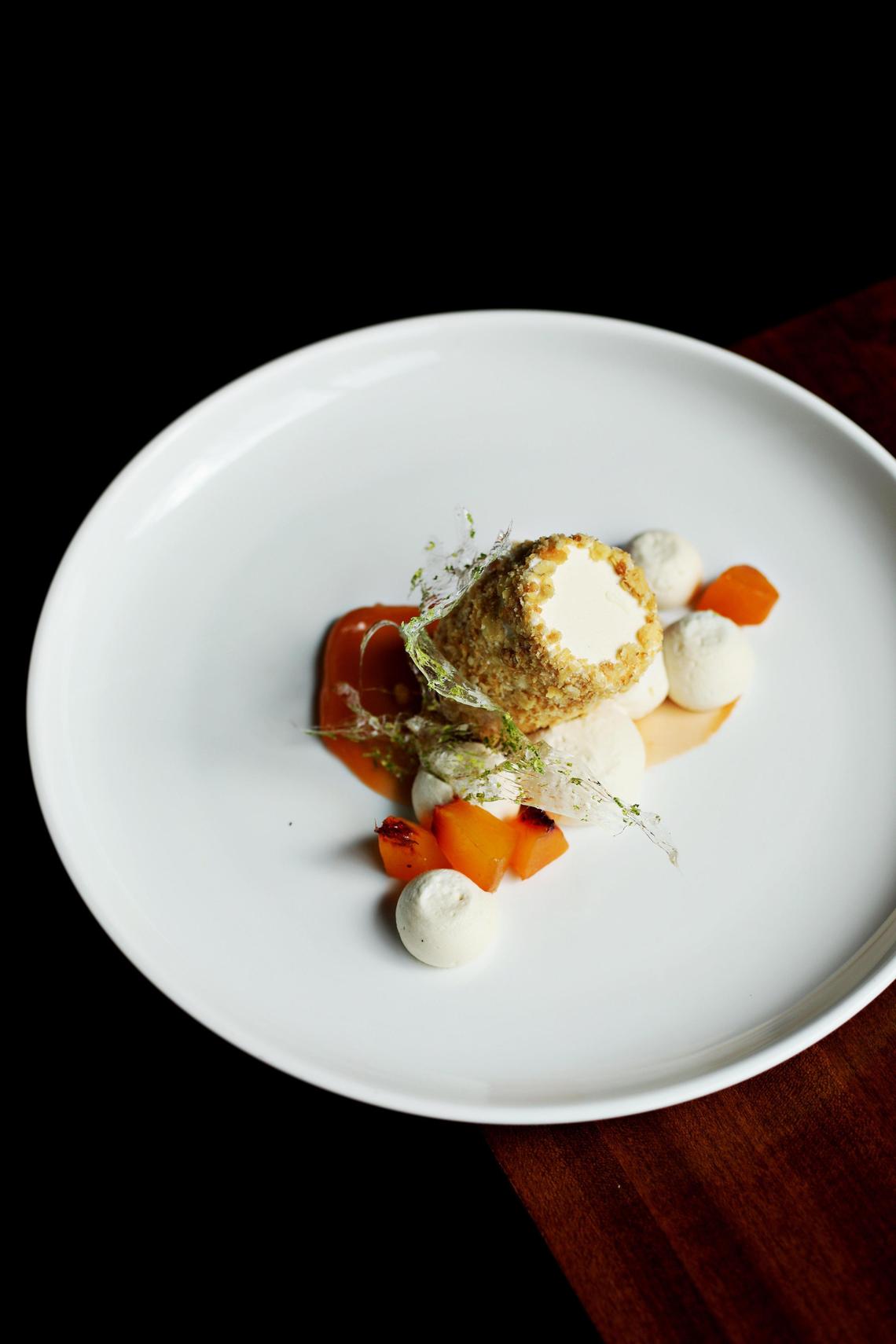 Oak Steakhouse in downtown Raleigh serves the most elegant take on a key lime icebox pie youÕre ever likely to see, enrobed in brown butter-enriched crushed saltines and garnished with compressed peaches and dollops of juniper-scented whipped cream.