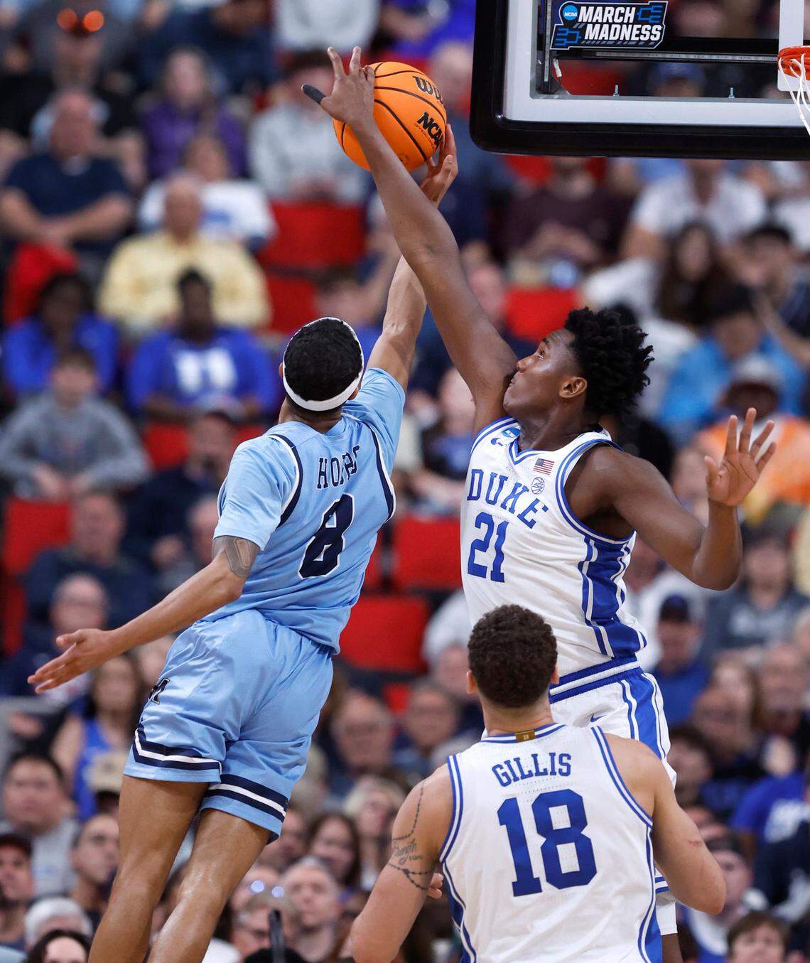 Duke’s Patrick Ngongba II (21) blocks the shot by Mount St. Mary’s Dallas Hobbs (8) during the second half of Duke’s 93-49 victory over Mount St. Mary’s in the first round of the 2025 NCAA Men’s Basketball Tournament at the Lenovo Center in Raleigh, N.C., Friday, March 21, 2025.