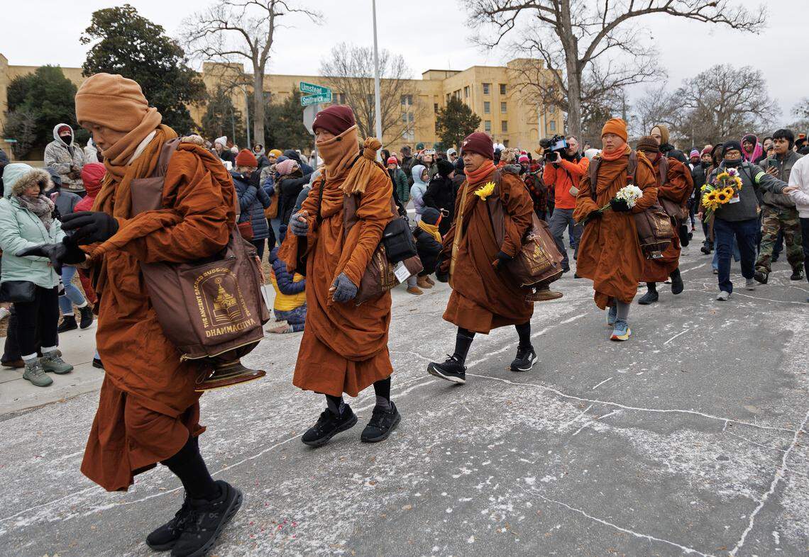 Buddhist monks walk through Dorothea Dix Park as a part of their Walk for Peace on Saturday.