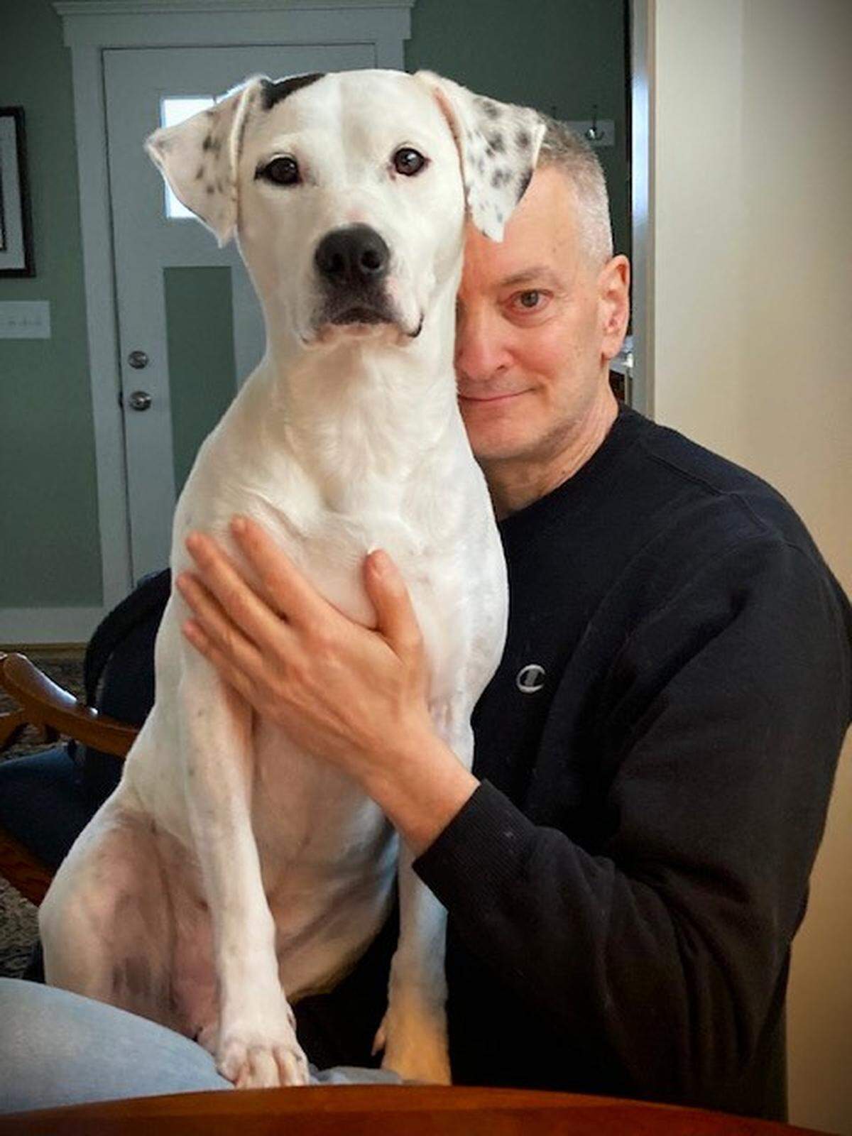Metro editor Mark Schultz, with his dog Blue. At times the two hear coyotes yip and howl at night when they walk on Orange County’s Blackwood Mountain.