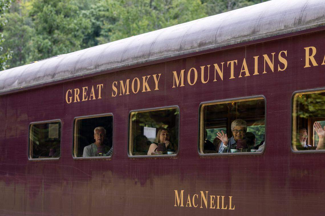 Tourists ride the Great Smoky Mountain Railroad during a steam engine excursion in the Nantahala Gorge.