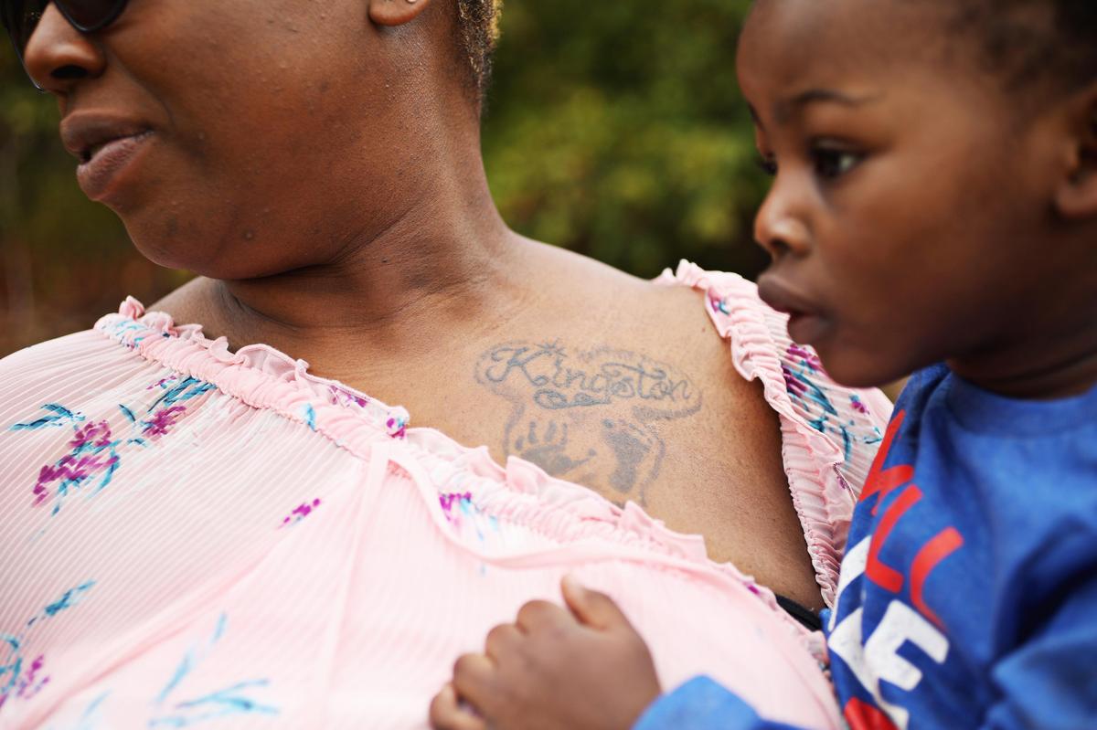 Durham resident Laura Miles had her first child, Kingston’s hand and foot prints tattooed on her chest shortly after he died in 2009. Kingston, who only lived briefly after birth, would be turning 11 this summer.