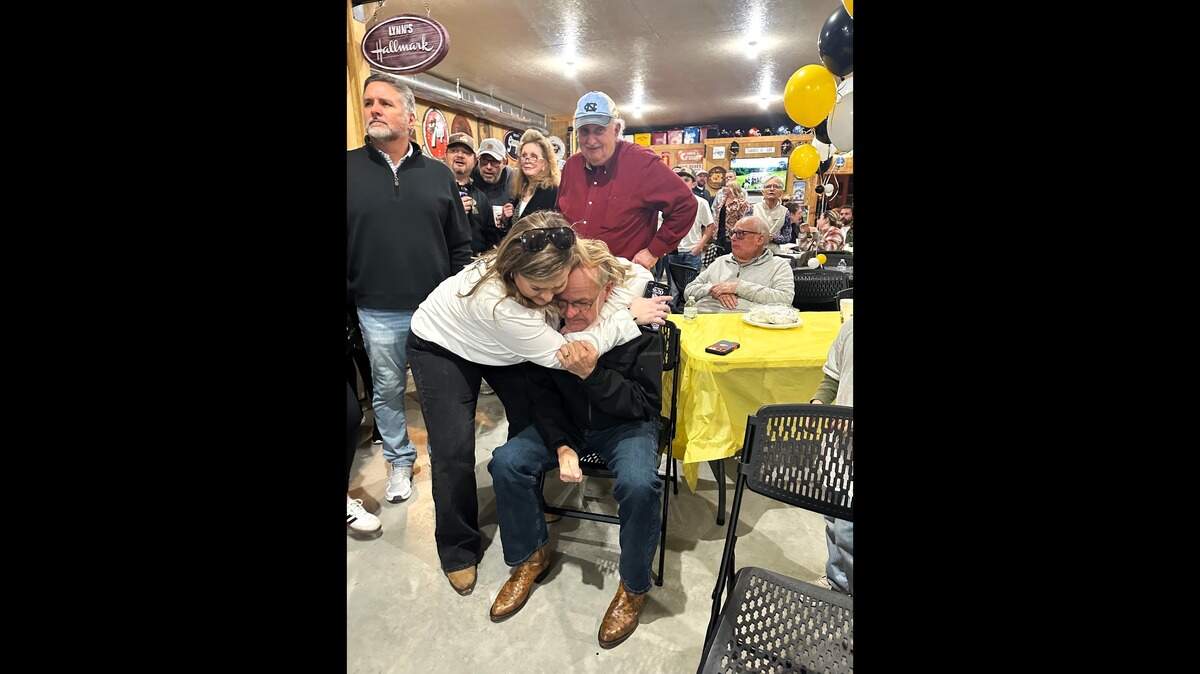 Sheriff Charles Blackwood gets a hug from his daughter, Jordan Frye, after learning he won a fourth term in Orange County on Tuesday night, March 3, 2026.