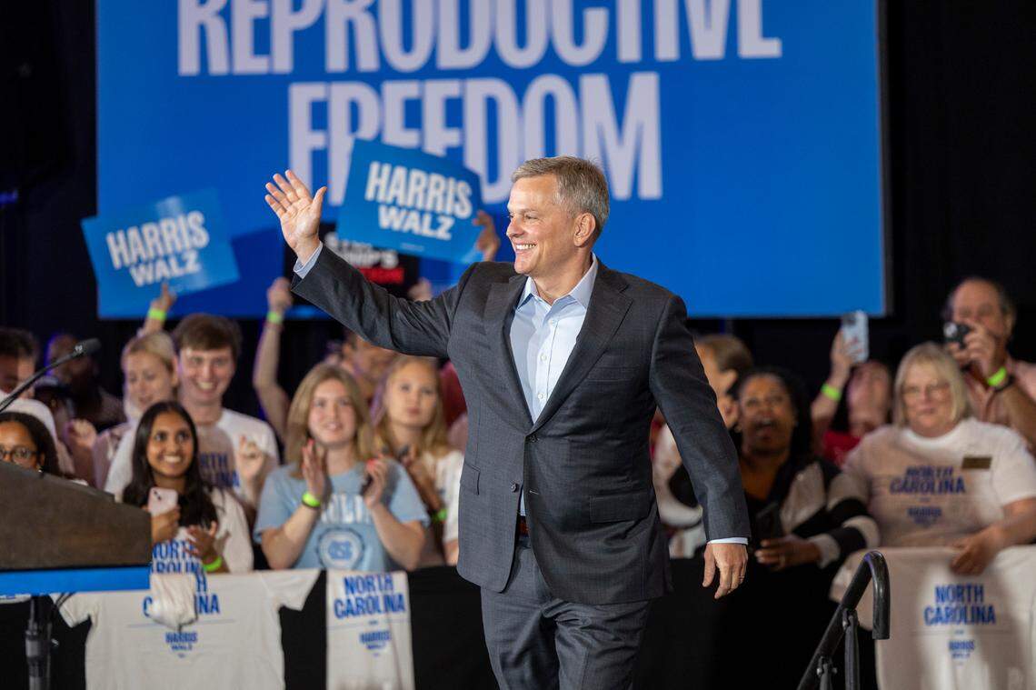 Attorney General Josh Stein takes the stage during a campaign rally featuring second gentleman Doug Emhoff and Minnesota first lady Gwen Walz as part of the “Fighting for Reproductive Freedom” bus tour stop at Market Hall in Raleigh on Monday, Sept. 9, 2024.