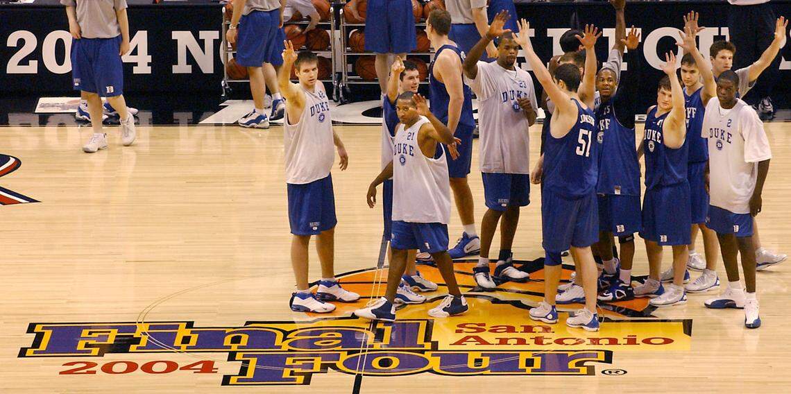 The Duke men’s basketball team waves to fans after practice at the Alamodome in San Antonio in April 2004 before their national semifinal game against UConn.
