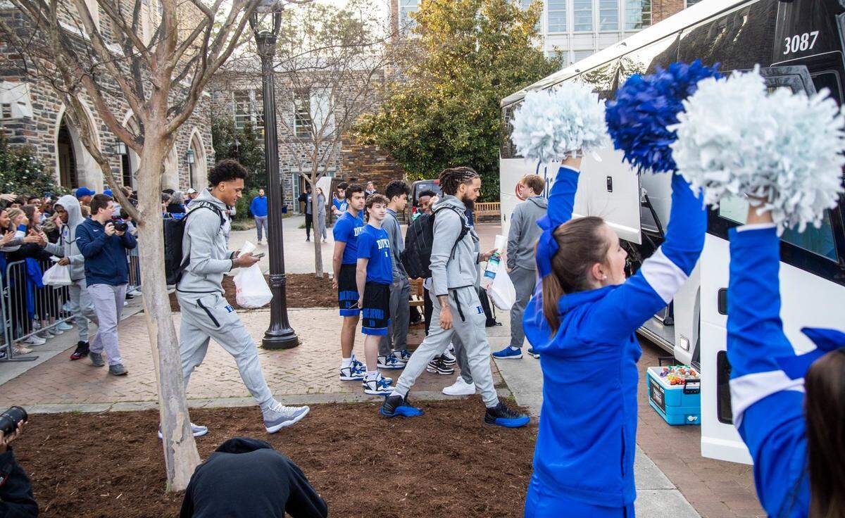 Duke’s Paolo Banchero, and Theo John prepare to depart for the Final Four in New Orleans Tuesday, March 29, 2022 outside Cameron Indoor Stadium.
