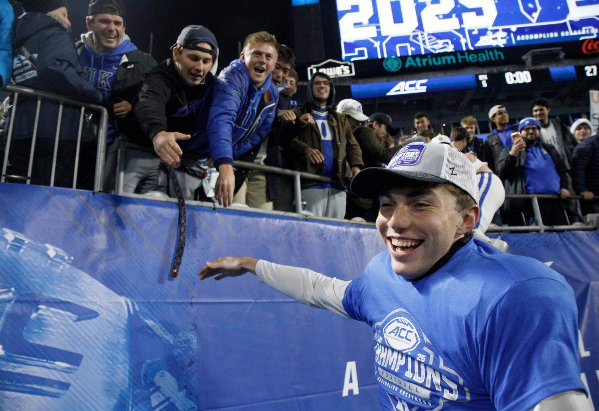 Duke kicker Todd Pelino greets fans following the Blue Devils’ 27-20 overtime win over Virginia in the ACC Football Championship on Saturday, Dec. 6, 2025, at Bank of America Stadium in Charlotte, N.C.